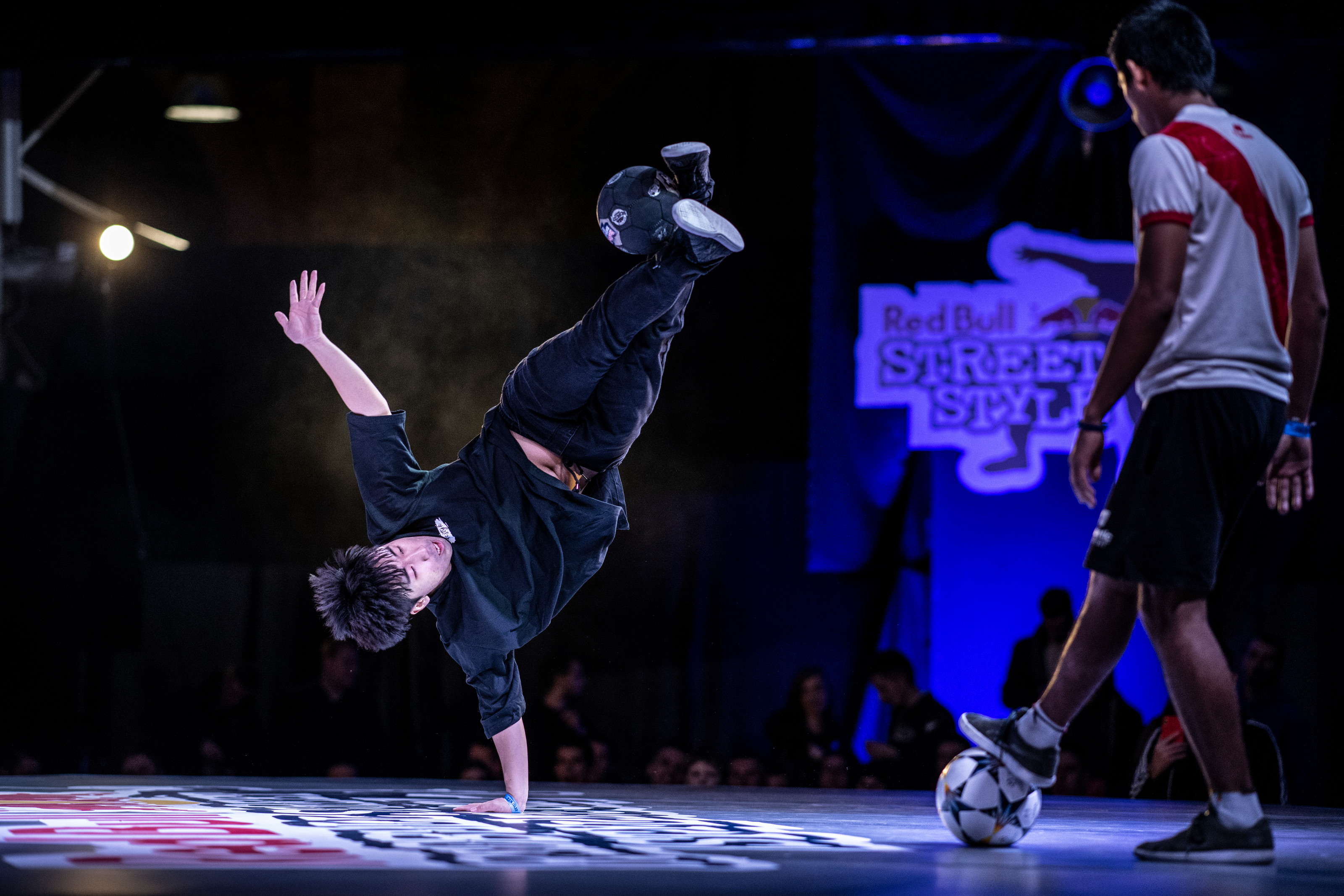 Park "Jinkun" Suk of South Korea competes against Luis Venancio (R) of Peru during qualifications for the Red Bull Street Style World Final at Hala Gwardii, Warsaw, Poland on November 21, 2018.